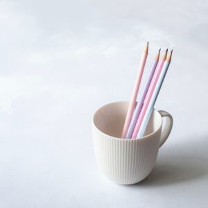 pastel pencils in a coffee cup